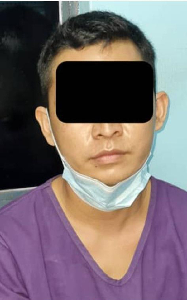 警方扣留当劳工的印尼籍男子。
