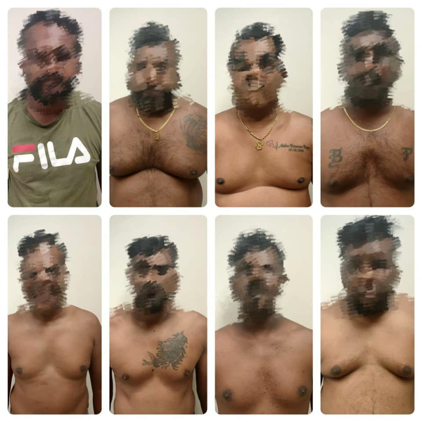 ■8名被捕的男子，当中7人身上纹有黑社会组织08和21的字眼、图案。（图：取自警方面子书）