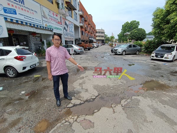 ■陈炜建指葡萄牙街泊车场道路窟窿四处。