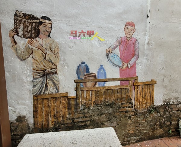 中国商人与马来人做生意的壁画。