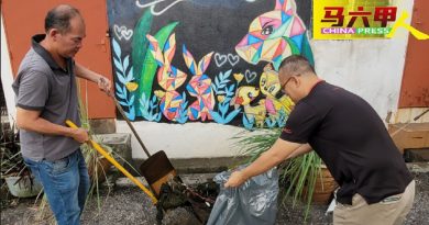 武雅拉也商家居协 联合志工清理后巷
