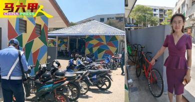 小贩中心外　乱乱泊  摩哆脚车碍交通接警告信